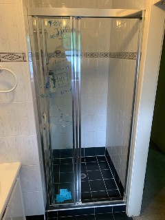 Fully-framed-shower-screen-wall-to-wall-with-sliding-door-chrome